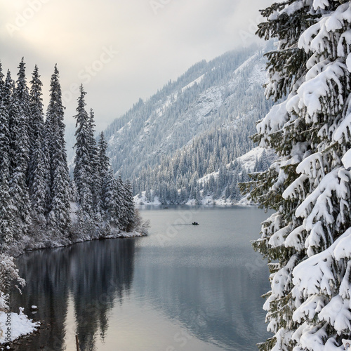 Mountain lake after snowfall. The Kulsai lake, Kazakhstan.