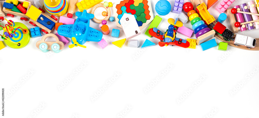 Baby kids toy banner background. Colorful educational toys on white background. Top view, flat lay, copy space for text Baby kids toy banner background. Colorful educational toys on white background. Top view, flat lay, copy space for text
