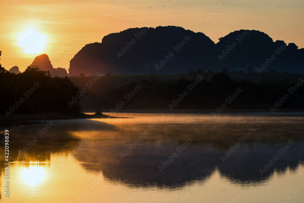 Rays of sunrise over Nong Thale lake, Krabi