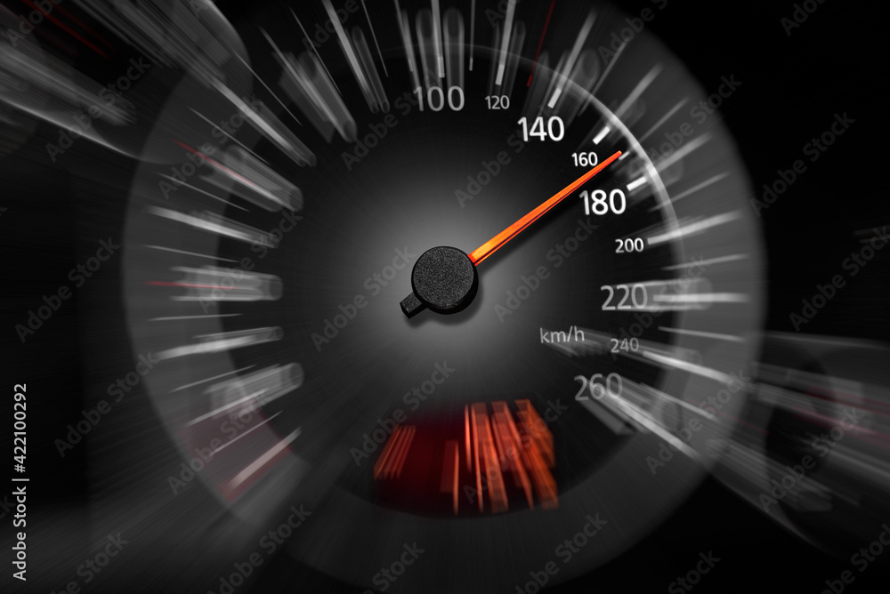 The speedometer of a modern car shows a high driving speed.