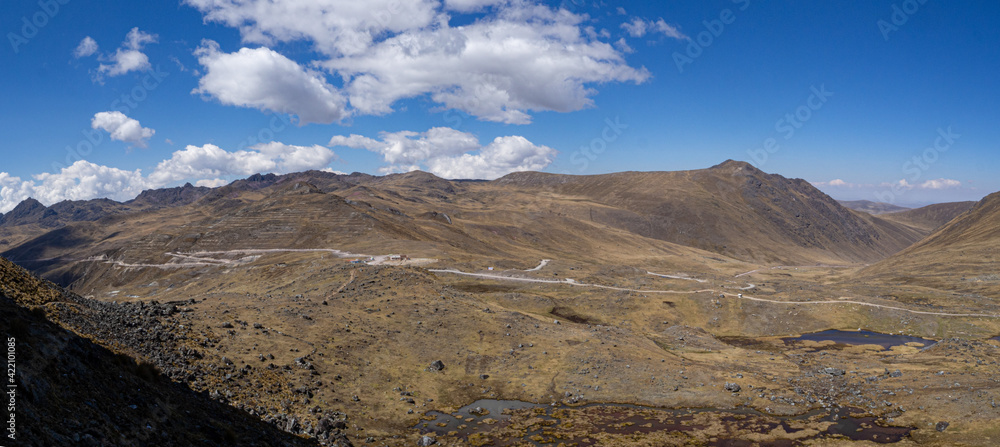 Panorama landscape of huge mountains with lake and clouds in cordilera Huaytapallana, Huancayo, peru	