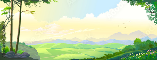 The landscape of distant mountains, hillocks, and blue skies.