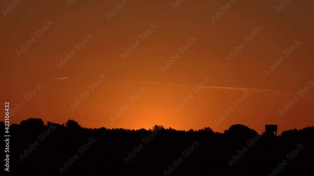 Closed frame timelapse of sunrise, dawning with beautiful colors until the sun rises. 4K. Pro Res. Closed frame timelapse of sunrise, dawning with beautiful colors until the sun rises. 4K. Pro Res.