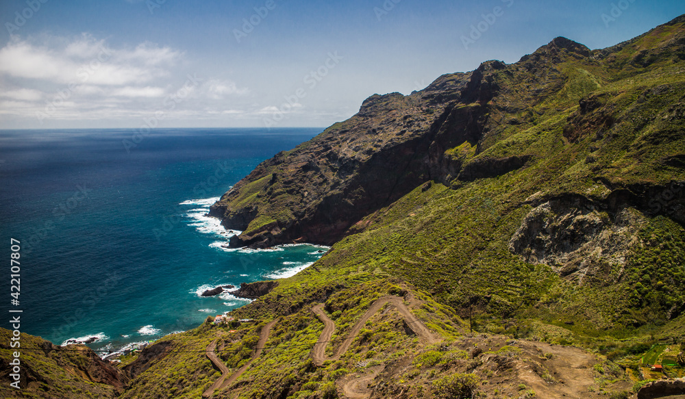 Hiking trail descending down to ocean and dramatic cliffs of Anaga mountains in Tenerife Hiking trail descending down to ocean and dramatic cliffs of Anaga mountains in Tenerife