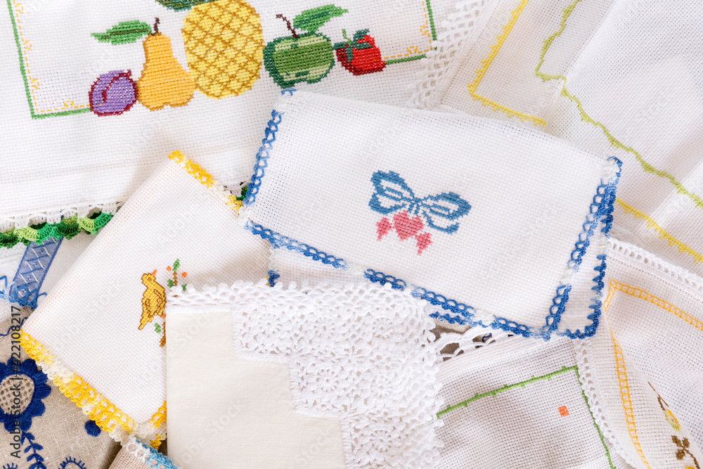 Close up of stitch cloth heart shape, fruits, on white fabric, napkin. Handmade favorite hobby or handcraft, baby patchwork Close up of stitch cloth heart shape, fruits, on white fabric, napkin. Handmade favorite hobby or handcraft, baby patchwork