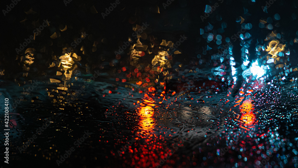 Fototapeta premium rain on car windows and car brake lights