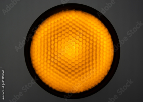 Background of pilot pulsed studio light with a honeycomb grid and diffuse film