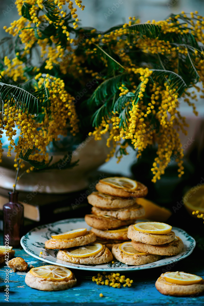 biscuits with lemon with a bouquet of mimosa.style vintage biscuits with lemon with a bouquet of mimosa.style vintage