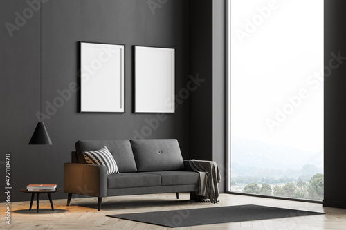 Dark living room interior with large panoramic window