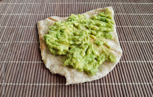Homemade bread pita with avocado sauce, breakfast