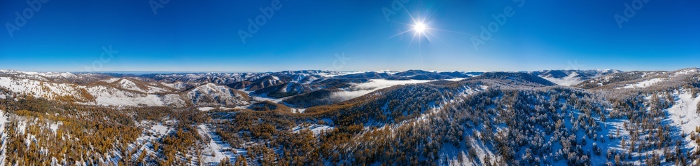 Panorama of Altai mountains in autumn. Seminsky ridge. Fog in the mountains. Aerial view. Original dimentions: 25813px x 6117px.