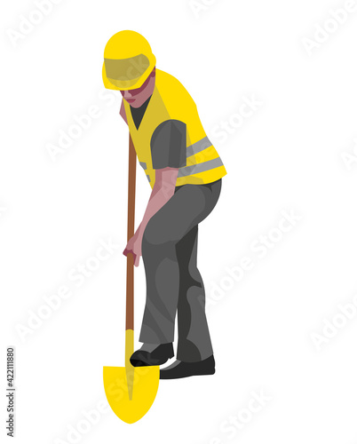 A dark-skinned worker in work clothes digs a hole with a shovel