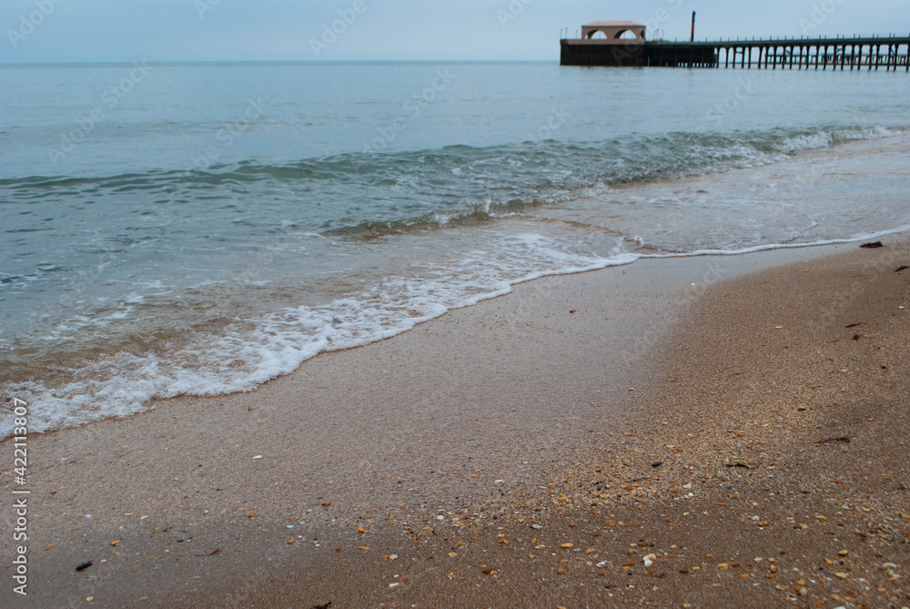 The view of the Caspian Sea in cloudy weather. The waves of the sea