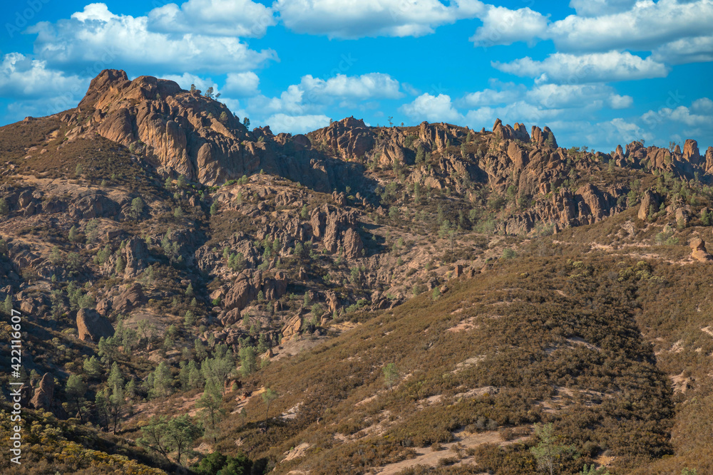 Rock formations in Pinnacles National Park in California, the destroyed remains of an extinct volcano on the San Andreas Fault. Beautiful landscapes, cozy hiking trails for tourists and travelers.