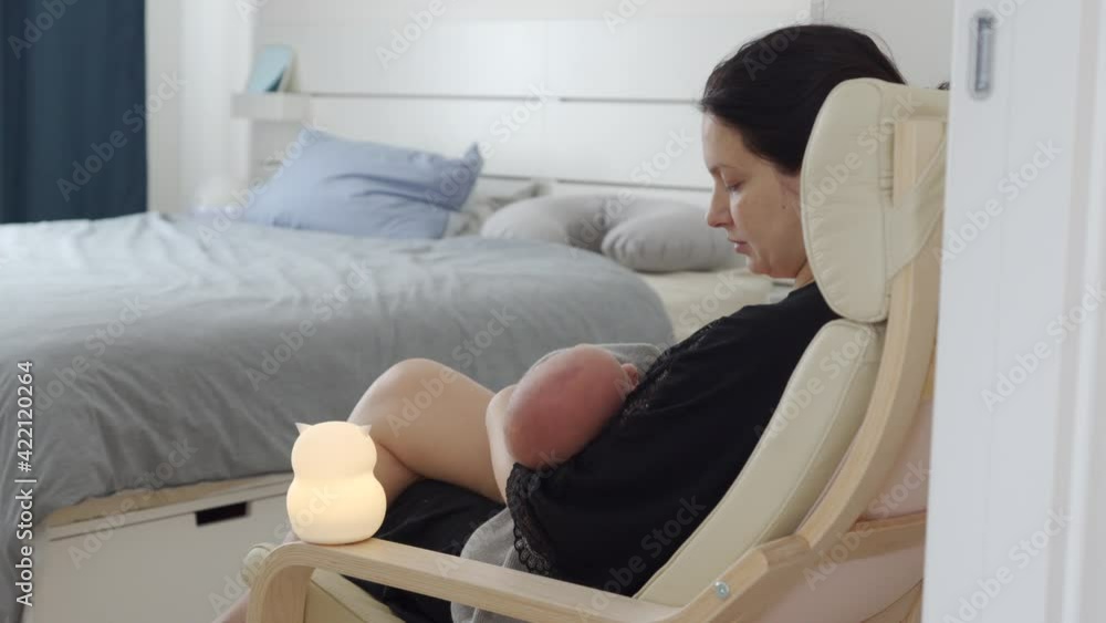 mother holding newborn baby infant in arms after breastfeeding at home, cute 3-week-old little boy. mother holding newborn baby infant in arms after breastfeeding at home, cute 3-week-old little boy.