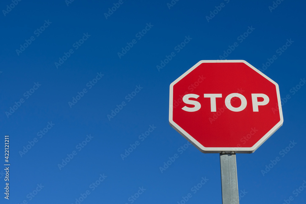 Stop traffic sign on blue background Stop traffic sign on blue background