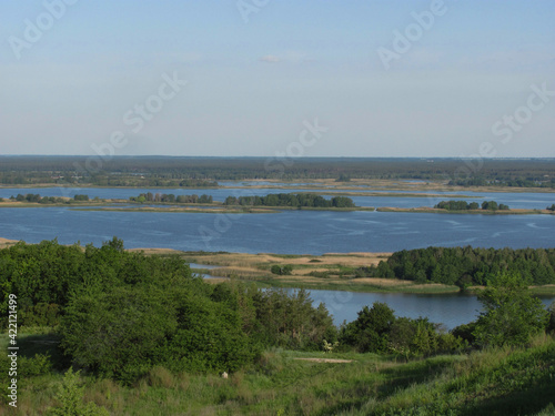 Wallpaper Mural landscape background: green forest, river with islands and blue sky Torontodigital.ca