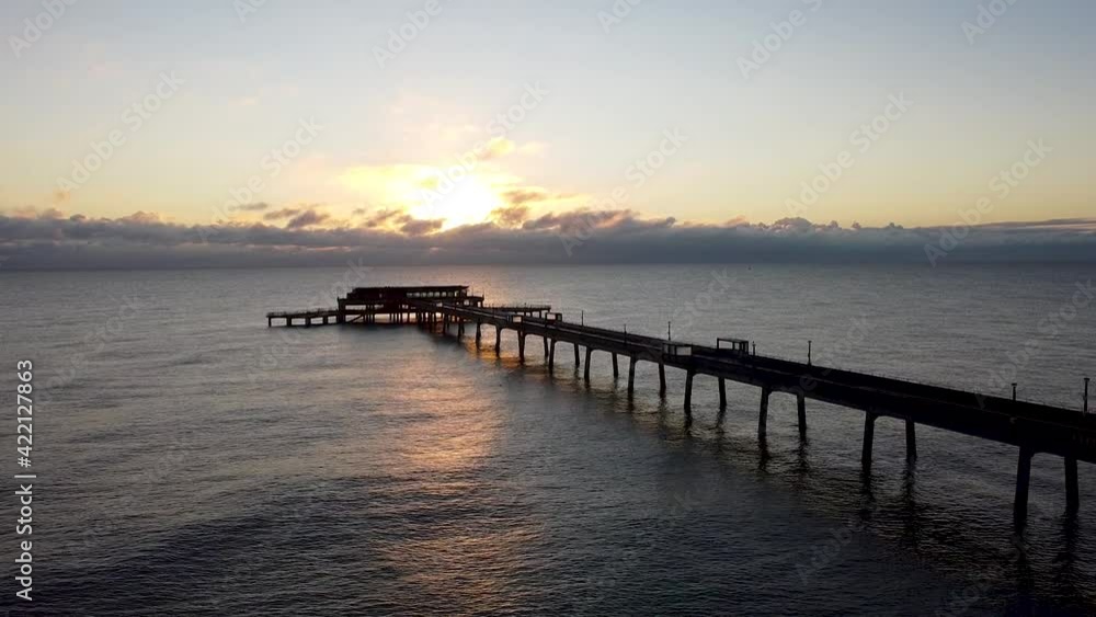 Scenic relaxing golden hour sunrise over Deal pier Kent rising aerial view above landmark Scenic relaxing golden hour sunrise over Deal pier Kent rising aerial view above landmark