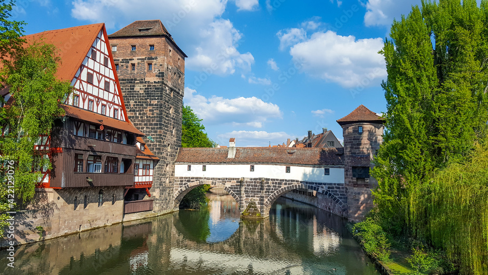 Medieval wine warehouse, water tower and bridge over the river. Nuremberg, Germany