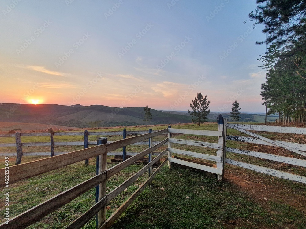 Fototapeta premium fence on the mountains at sunset
