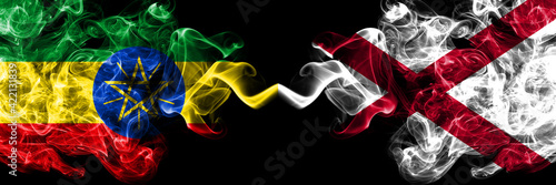 Ethiopia, Ethiopian vs Alabama, Alabamian smoky mystic flags placed side by side. Thick colored silky abstract smoke flags. photo