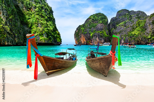 Beautiful beach with thai traditional wooden longtail boat and blue sky in Maya bay, Thailand. © preto_perola
