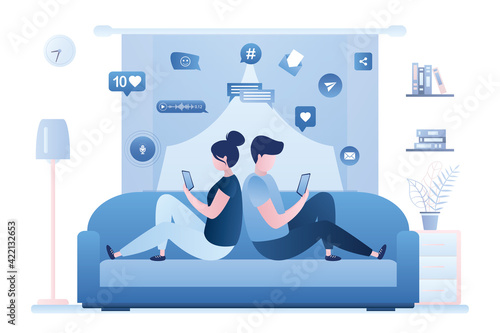 Couple sits back to back. Young adults sitting on sofa and uses cell phones. Social media communication. Various internet signs