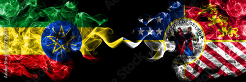 Ethiopia, Ethiopian vs United States of America, America, US, USA, American, Detroit, Michigan smoky mystic flags placed side by side. Thick colored silky abstract smoke flags.