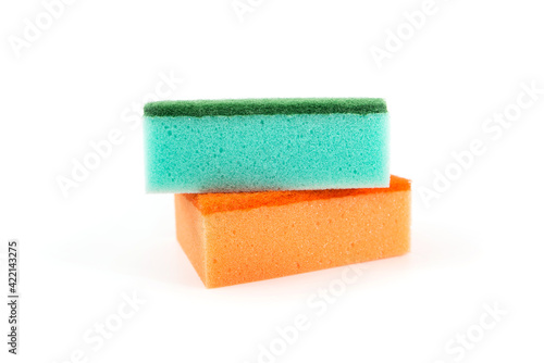 two scouring sponges on a white