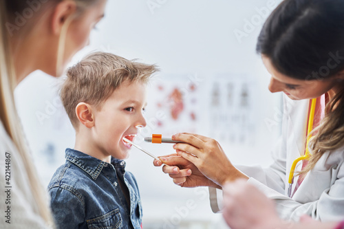 Bild auf Leinwand Little boy having medical examination by pediatrician