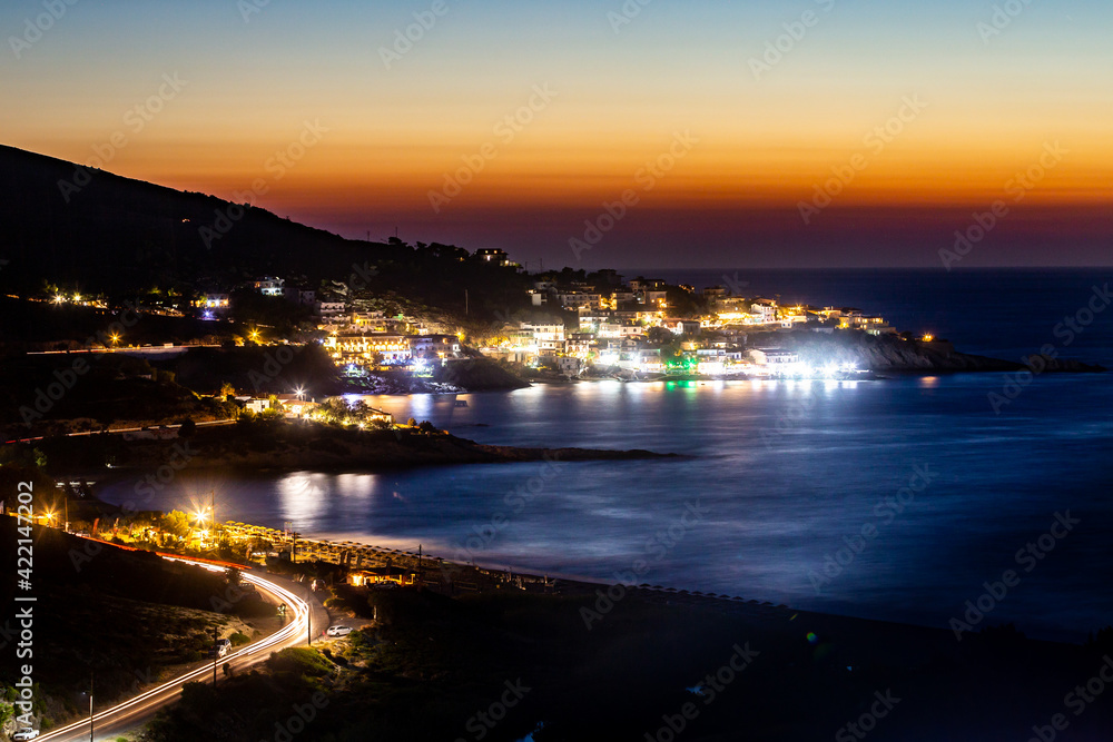 Night view of the coastal city Ikaria, Greece