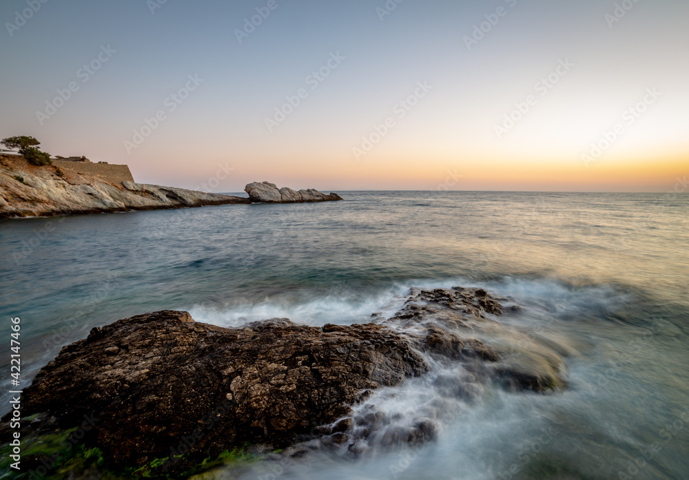 Sunset on the coast in Ikaria, Greece