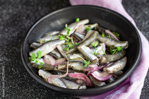 anchovy fish seafood marinated salad appetizer small herring healthy vegetarian pescetarian meal top view copy space food background rustic image