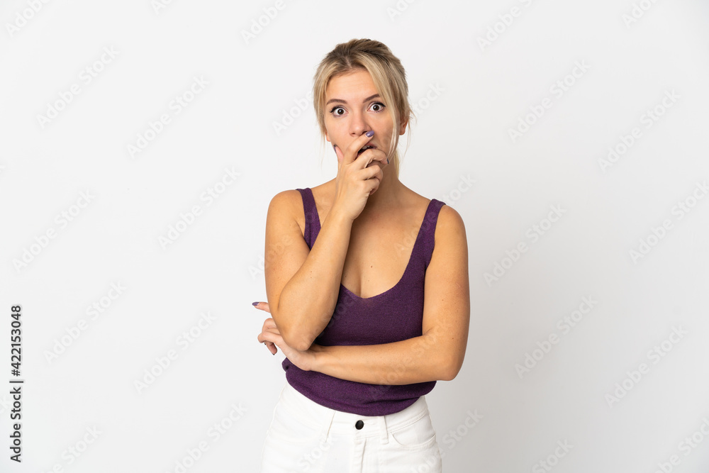 Young Russian woman isolated on white background surprised and shocked while looking right Young Russian woman isolated on white background surprised and shocked while looking right