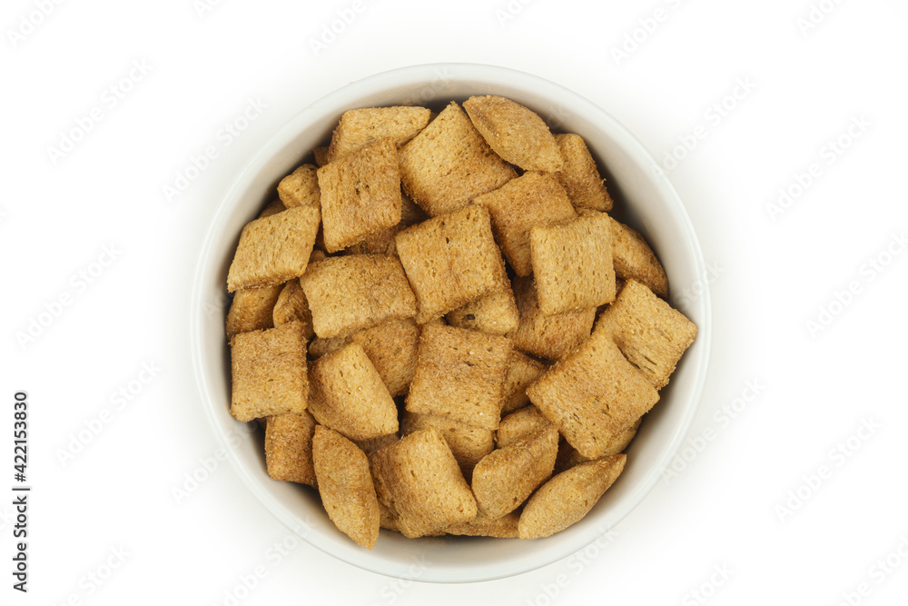 Chocolate breakfast pillows, in a white bowl on a white background. Top view Chocolate breakfast pillows, in a white bowl on a white background. Top view
