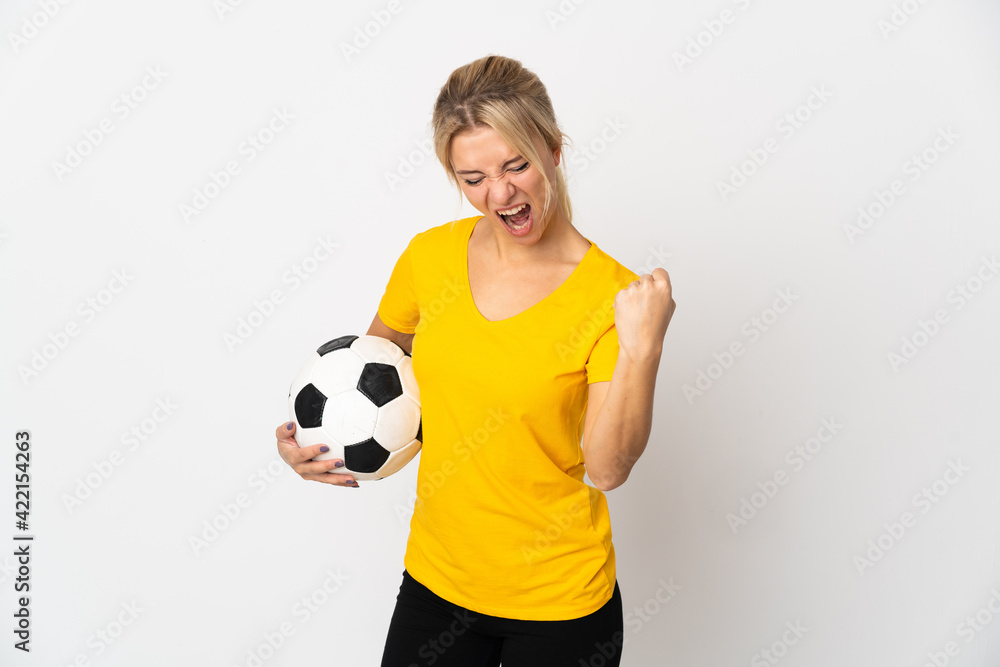 Young Russian woman isolated on white background with soccer ball celebrating a victory Young Russian woman isolated on white background with soccer ball celebrating a victory