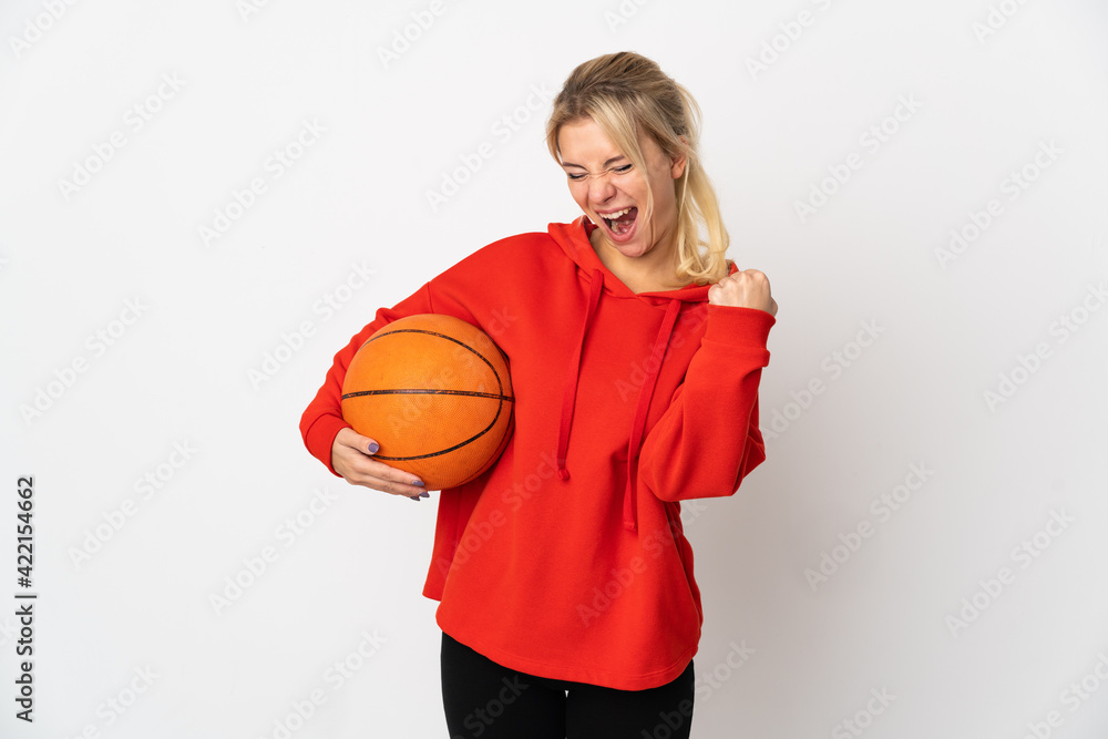 Young Russian woman isolated on white background playing basketball Young Russian woman isolated on white background playing basketball