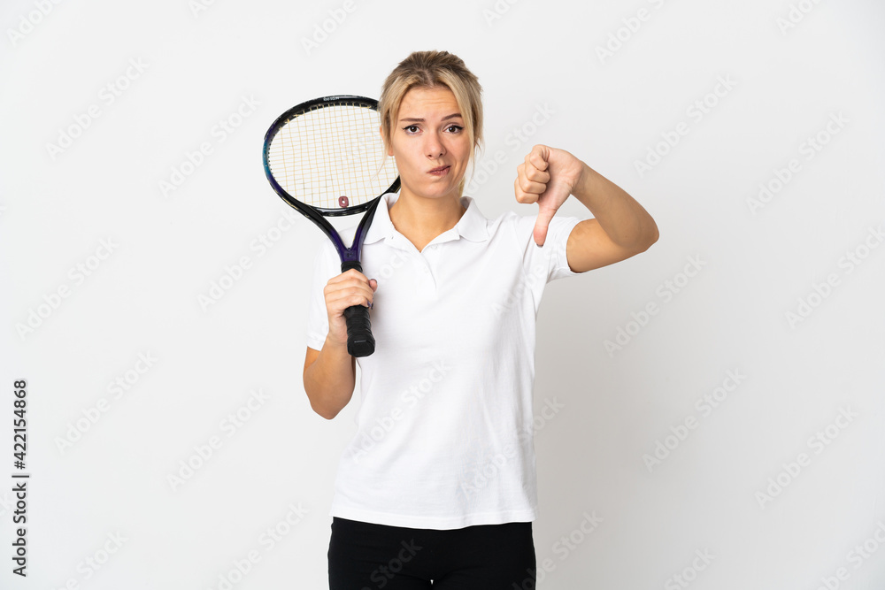 Young Russian woman tennis player isolated on white background showing thumb down with negative expression Young Russian woman tennis player isolated on white background showing thumb down with negative expression