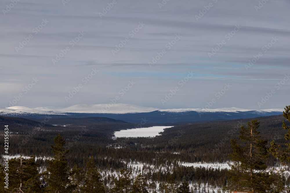 Winter landscape with Scandinavian mountains and a frozen lake.Shot at Idre fjäll in Sweden, Scandinavia.