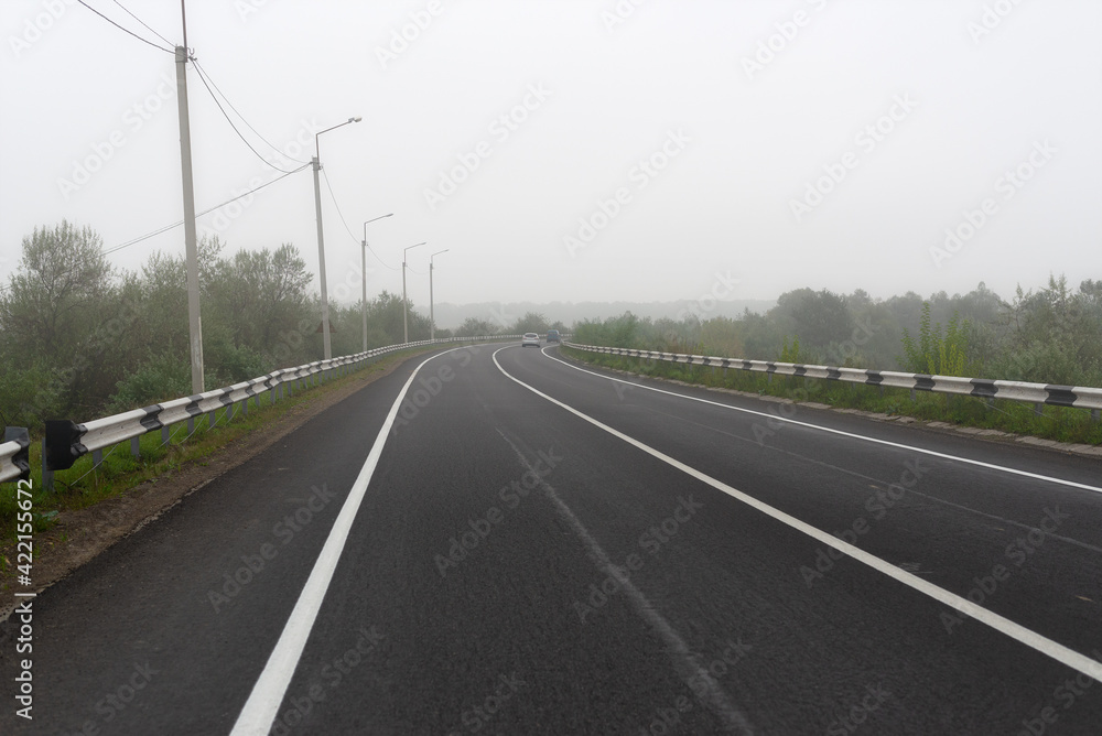 Dangerous country ride in fog with low driving speed