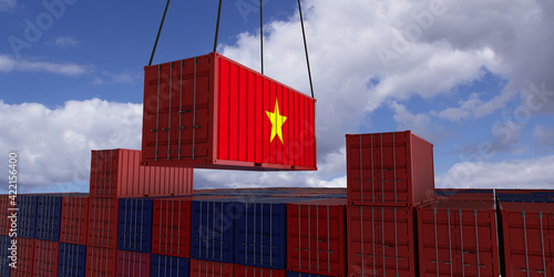 Fotografi A freight container with the vietnamese flag hangs in front of many blue and red
