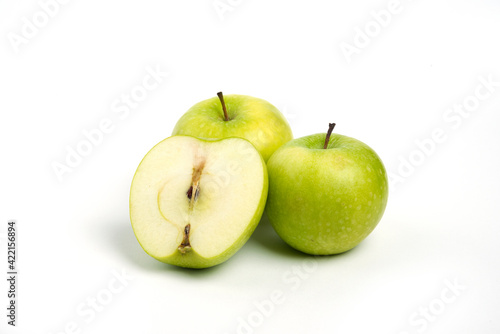 Three fresh whole and sliced apples on white background