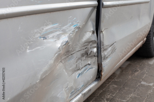 Damaged vehicle detail, scratches on the doors.