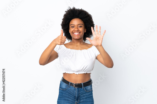 Young African American woman isolated on white background counting six with fingers
