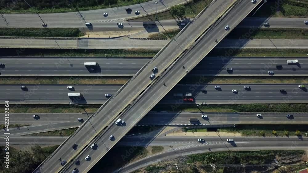 Static aerial drone shot of busy highway interchange ramps with city traffic vehicles Static aerial drone shot of busy highway interchange ramps with city traffic vehicles