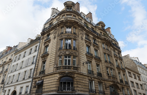 Traditional French house with typical balconies and windows. Paris . © kovalenkovpetr
