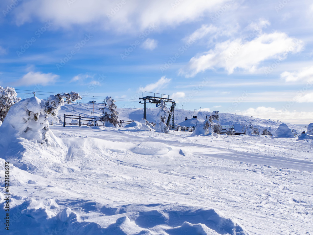 Blue sky, snow and a ski lift in Lapland, Finland