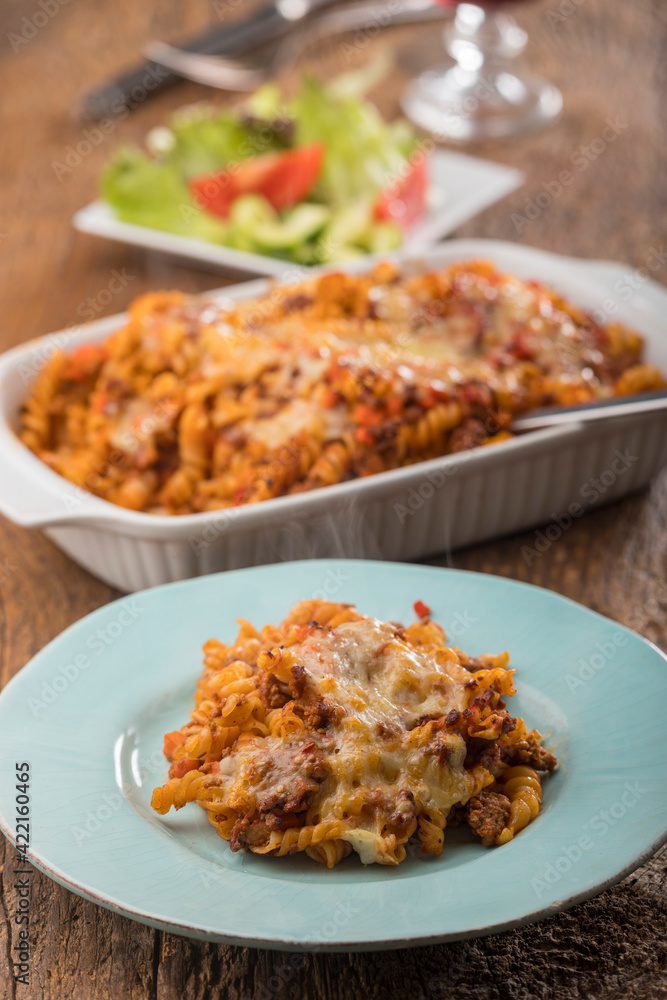gratinated pasta on wood gratinated pasta on wood