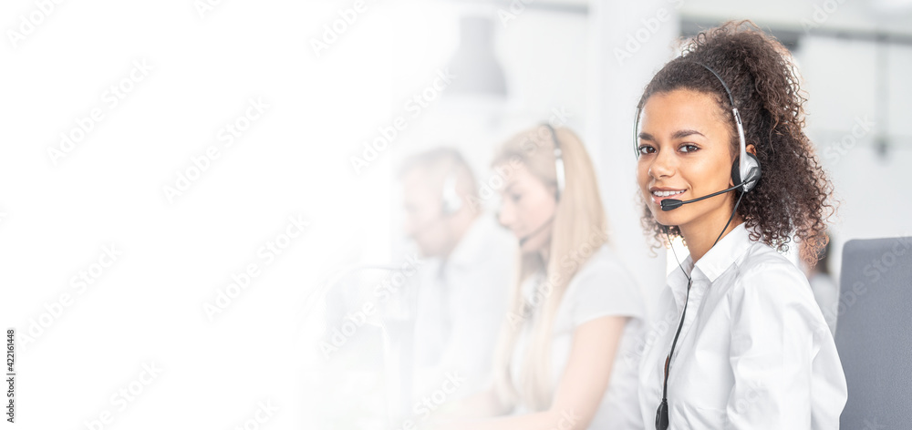 Call center worker accompanied by her team. Call center worker accompanied by her team.