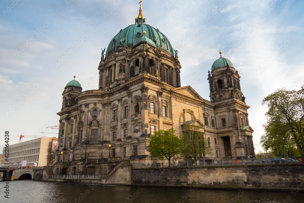 Berlin, Germany; April 11, 2017:View of the cathedral, Berliner Dom, on the famous Museum Island, Museumsinsel and the river Spree.